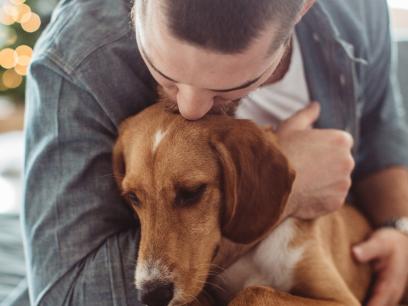 hospice care for dogs-man hugging dog