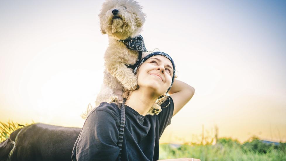 woman-holding-dog-on-shoulder