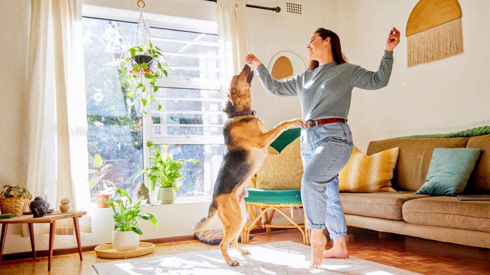 dog-and-woman-dancing-in-living-room